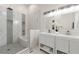 Modern bathroom boasts double vanity, marble tile, and a large shower at 2212 Glendale Dr, Decatur, GA 30032