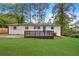 Ranch-style home with a newly renovated exterior and a modern deck at 2212 Glendale Dr, Decatur, GA 30032