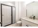 Updated bathroom with a walk-in shower, quartz vanity, and marble floor at 2487 Figaro Dr, Atlanta, GA 30339