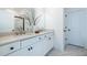 Modern bathroom with double vanity, quartz countertop, and marble-look tile floor at 2487 Figaro Dr, Atlanta, GA 30339