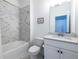 Clean bathroom with a shower/tub combo and white vanity at 2487 Figaro Dr, Atlanta, GA 30339