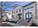 Brick front elevation of charming townhome with welcoming porch and stairs at 2487 Figaro Dr, Atlanta, GA 30339