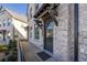 Front entrance of townhome, featuring a gray door and brick facade at 2487 Figaro Dr, Atlanta, GA 30339