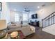 Open living area showcasing hardwood floors and a sectional sofa at 2487 Figaro Dr, Atlanta, GA 30339