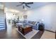 Living room with hardwood floors, sectional sofa, and view into dining area at 2487 Figaro Dr, Atlanta, GA 30339