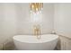 Luxury bathroom featuring a white soaking tub and gold accents at 2671 Caldwell Ne Rd, Brookhaven, GA 30319