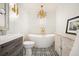 Elegant bathroom with freestanding tub and patterned tile at 2671 Caldwell Ne Rd, Brookhaven, GA 30319