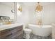 Elegant bathroom with a freestanding tub and gold fixtures at 2671 Caldwell Ne Rd, Brookhaven, GA 30319