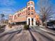 Brick building exterior with retail spaces on the ground floor at 2671 Caldwell Ne Rd, Brookhaven, GA 30319