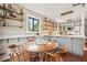 Charming dining area with a wooden table and gray kitchen cabinets at 2671 Caldwell Ne Rd, Brookhaven, GA 30319