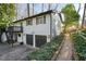 White house with dark garage doors and walkway at 2671 Caldwell Ne Rd, Brookhaven, GA 30319