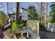 White house exterior with deck, lattice fence, and landscaping at 2671 Caldwell Ne Rd, Brookhaven, GA 30319