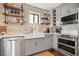 Gray kitchen cabinets, white quartz countertops, and a farmhouse sink at 2671 Caldwell Ne Rd, Brookhaven, GA 30319