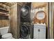 Stackable washer and dryer in a rustic laundry room at 2671 Caldwell Ne Rd, Brookhaven, GA 30319