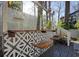 Stylish outdoor bar with patterned tile and wicker barstools on a deck at 2671 Caldwell Ne Rd, Brookhaven, GA 30319