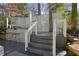 Outdoor bar with patterned tile backsplash, wicker stools, and string lights at 2671 Caldwell Ne Rd, Brookhaven, GA 30319