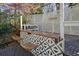 Outdoor bar with wood countertop, patterned tile, and wicker stools at 2671 Caldwell Ne Rd, Brookhaven, GA 30319