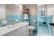 Charming bathroom with light blue tile and updated vanity at 2833 Alan Sw Dr, Marietta, GA 30064