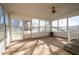 Bright sunroom with concrete floor, screened windows, and ceiling fan at 2833 Alan Sw Dr, Marietta, GA 30064