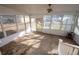 Screened sunroom with concrete floor and ceiling fan at 2833 Alan Sw Dr, Marietta, GA 30064