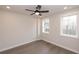 Spacious bedroom with hardwood floors and two windows at 530 Fisher Dr # 45, Alpharetta, GA 30009