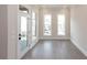 Bright bedroom featuring hardwood floors and access to a private balcony at 530 Fisher Dr # 45, Alpharetta, GA 30009