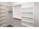 Spacious walk-in closet with ample shelving and hanging rods at 530 Fisher Dr # 45, Alpharetta, GA 30009