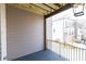 Private deck with gray siding and black metal railing at 530 Fisher Dr # 45, Alpharetta, GA 30009