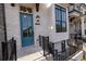 Charming brick townhouse featuring a teal front door and black wrought iron railings on the entry stairs at 530 Fisher Dr # 45, Alpharetta, GA 30009