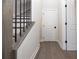 Bright hallway with hardwood floors and white doors at 530 Fisher Dr # 45, Alpharetta, GA 30009
