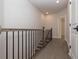 Elegant hallway with wood floors and black metal railing at 530 Fisher Dr # 45, Alpharetta, GA 30009