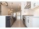Open concept kitchen with island, stainless steel appliances, and hardwood floors at 530 Fisher Dr # 45, Alpharetta, GA 30009