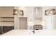 Modern kitchen with white cabinets, stainless steel appliances, and large island at 530 Fisher Dr # 45, Alpharetta, GA 30009