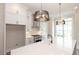 Modern kitchen with white cabinets, quartz countertops and black accents at 530 Fisher Dr # 45, Alpharetta, GA 30009