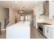 Modern kitchen with large island, stainless steel appliances and hardwood floors at 530 Fisher Dr # 45, Alpharetta, GA 30009