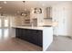 Modern kitchen with white cabinets, large island, and stainless steel appliances at 530 Fisher Dr # 45, Alpharetta, GA 30009