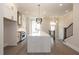 Open kitchen with large island, stainless steel appliances, and hardwood floors at 530 Fisher Dr # 45, Alpharetta, GA 30009