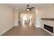 Open living room with hardwood floors, fireplace, and access to kitchen at 530 Fisher Dr # 45, Alpharetta, GA 30009