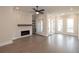 Bright living room with hardwood floors, fireplace, and multiple windows at 530 Fisher Dr # 45, Alpharetta, GA 30009