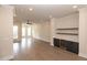 Spacious living room with hardwood floors, fireplace, and built-in shelving at 530 Fisher Dr # 45, Alpharetta, GA 30009