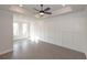 Main bedroom with hardwood floors, tray ceiling and wainscoting at 530 Fisher Dr # 45, Alpharetta, GA 30009