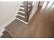 Elegant staircase with dark wood and metal railing at 530 Fisher Dr # 45, Alpharetta, GA 30009