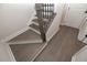 Modern staircase with dark wood treads and black metal balusters at 530 Fisher Dr # 45, Alpharetta, GA 30009