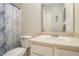 Clean bathroom with a shower/tub combo, vanity, and updated fixtures at 1246 Carriage Trace Cir, Stone Mountain, GA 30087