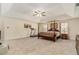 Large bedroom with a carpeted floor, lots of natural light and a ceiling fan at 1246 Carriage Trace Cir, Stone Mountain, GA 30087