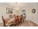 Formal dining room with chandelier and table for eight at 1246 Carriage Trace Cir, Stone Mountain, GA 30087