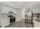 Bright kitchen with stainless steel appliances and white cabinets at 1246 Carriage Trace Cir, Stone Mountain, GA 30087