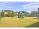 Fenced backyard with playset and open grassy area at 4745 Billow Sw Way, Mableton, GA 30126