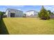 Large backyard with grassy lawn, playground, and privacy fence at 4745 Billow Sw Way, Mableton, GA 30126