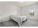 Cozy bedroom with gray carpet and a large window offering natural light at 4745 Billow Sw Way, Mableton, GA 30126